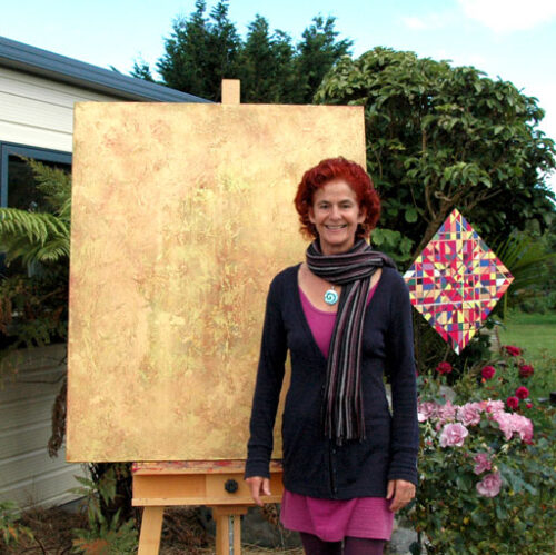 about-the-artist-ruth-at-home women standing outside in front of gold abstract painting