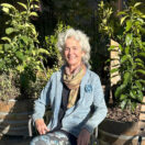 ruth-in-switzerland-2024 women sitting in between two plants in switzerland